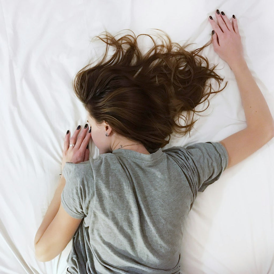 Woman laying on bed comfortably